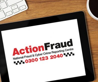 Action Fraud Logo show on a iPad on a desk