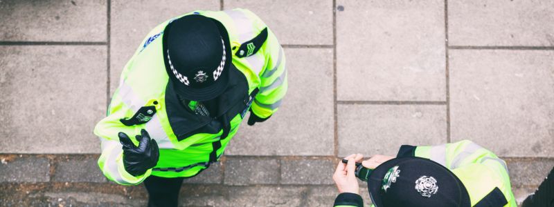Bird-eye view of officers discussing on a street