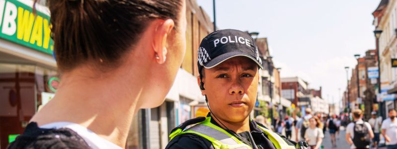 Officer looking at a citizen on the street