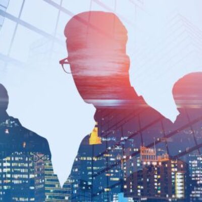 Image of profile of people on a digital skyline