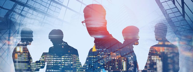Image of profile of people on a digital skyline