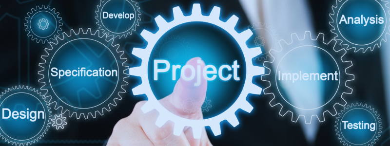 Finger pointing at a digital wheel with the text 'project'